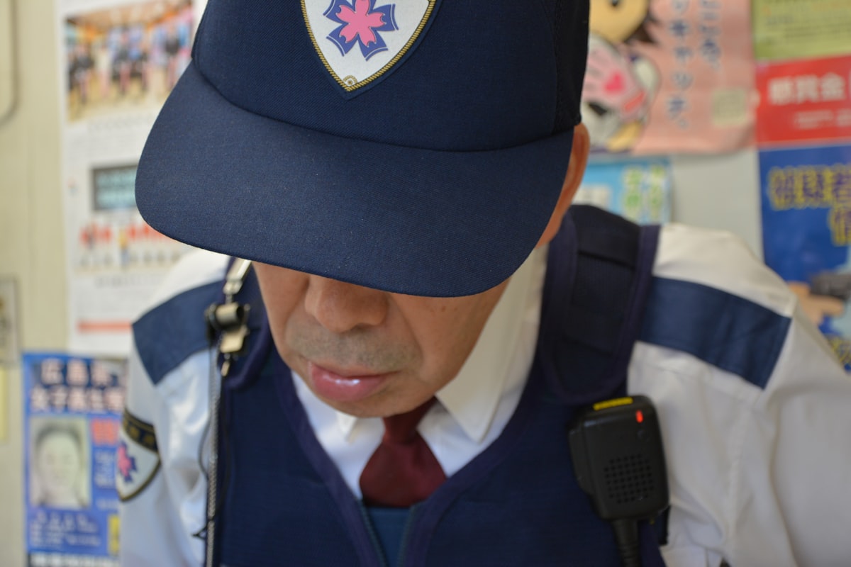 Professional security guard using modern digital tools